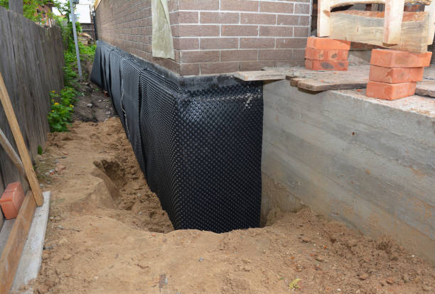 Happy homeowners after waterproofing job in Burtonsville